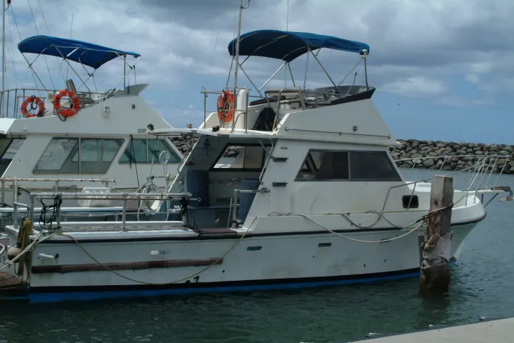 a boat is docked next to a body of water