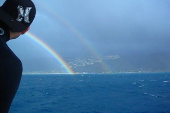 a rainbow over a body of water
